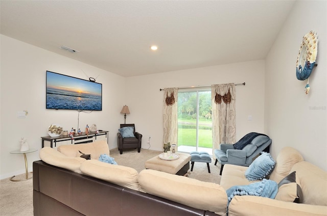 living room with visible vents and light carpet