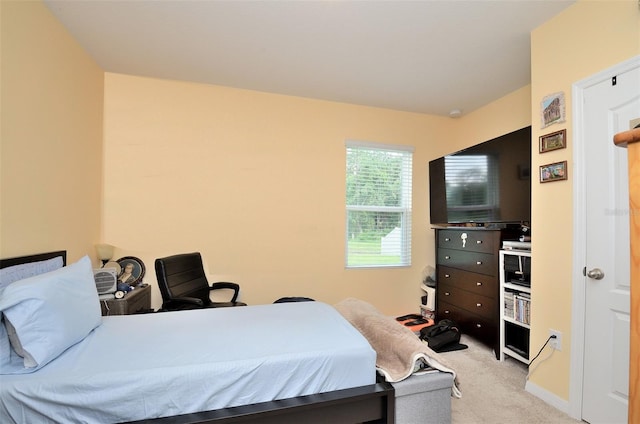 bedroom with light colored carpet