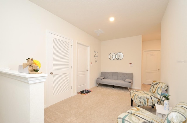 sitting room with carpet floors