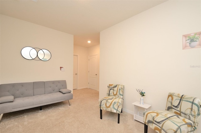 interior space with light carpet and baseboards