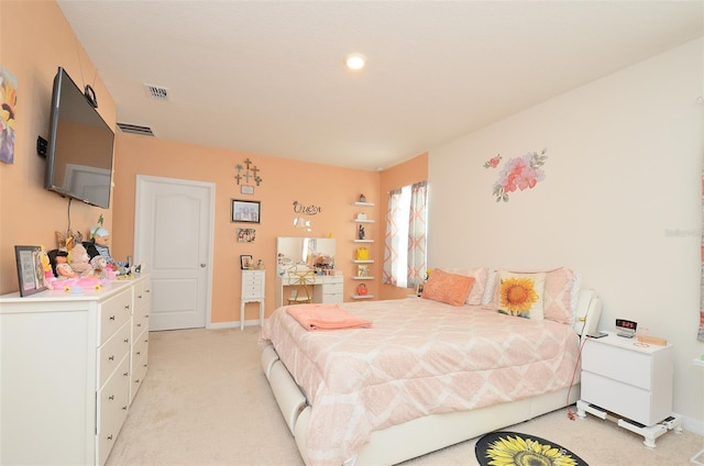 bedroom featuring visible vents, baseboards, and light colored carpet