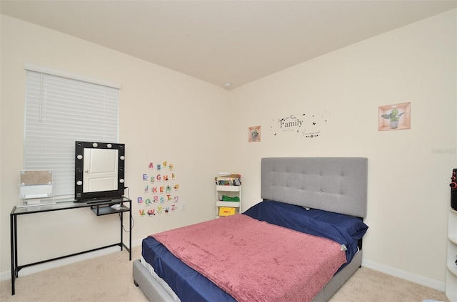 bedroom featuring baseboards and carpet floors