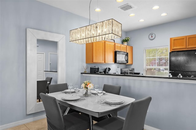 dining space with light tile patterned flooring, visible vents, recessed lighting, and baseboards