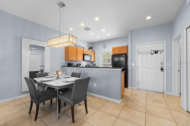 dining area with light tile patterned floors, recessed lighting, visible vents, and baseboards