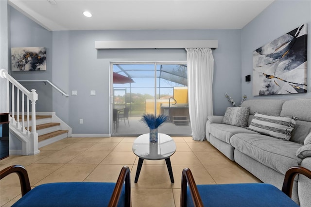 living area with stairway, light tile patterned flooring, recessed lighting, and baseboards