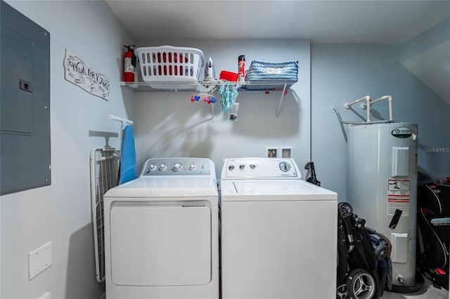 clothes washing area with laundry area, electric panel, water heater, and washer and clothes dryer