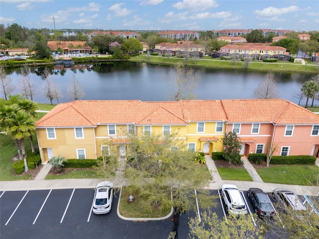 aerial view with a residential view and a water view