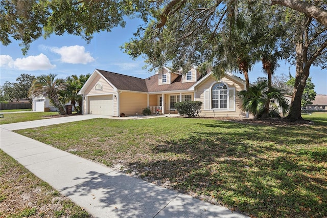 view of front of house featuring a front lawn, concrete driveway, and a garage