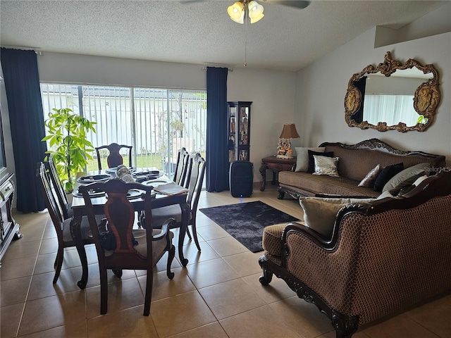 633 Kangaroo Dr, Kissimmee, FL 34759 - dining area featuring tile patterned floors, a ceiling fan, and a textured ceiling