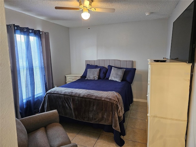 633 Kangaroo Dr, Kissimmee, FL 34759 - bedroom featuring tile patterned floors, ceiling fan, and a textured ceiling