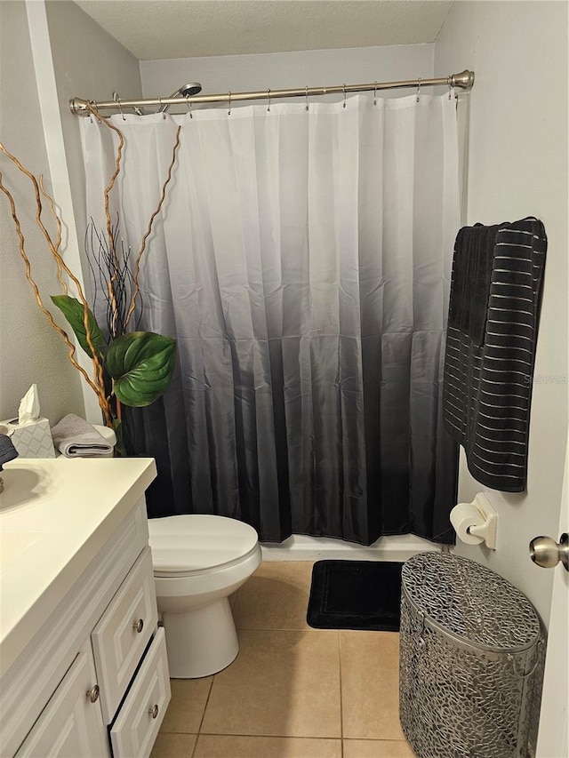633 Kangaroo Dr, Kissimmee, FL 34759 - full bath with tile patterned floors, a shower with shower curtain, toilet, and vanity