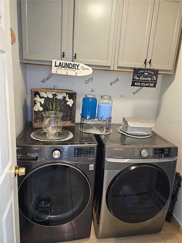 633 Kangaroo Dr, Kissimmee, FL 34759 - laundry room featuring independent washer and dryer, cabinet space, and tile patterned floors
