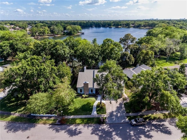 aerial view featuring a water view and a wooded view