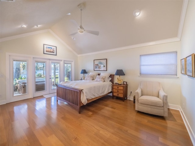 bedroom with baseboards, lofted ceiling, french doors, light wood-style floors, and access to outside