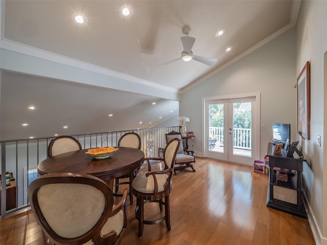 dining space with french doors, baseboards, wood finished floors, and crown molding