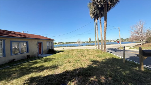 view of yard with a water view