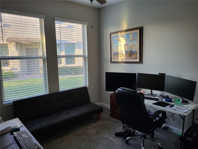 carpeted home office with baseboards