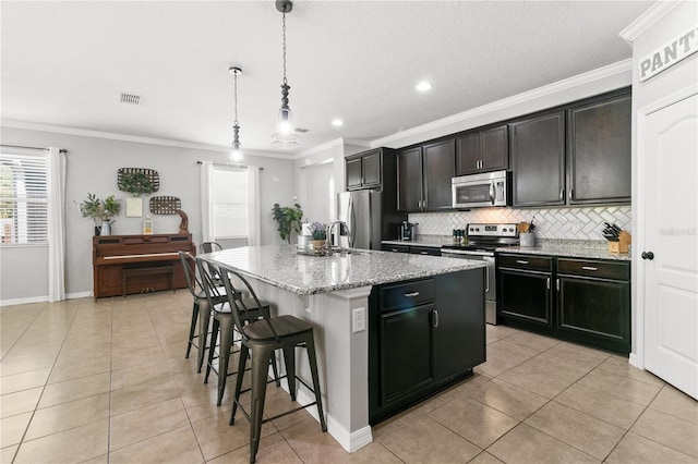 kitchen featuring decorative backsplash, stainless steel appliances, and crown molding