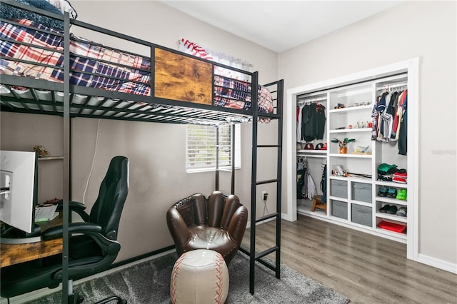 bedroom with wood finished floors