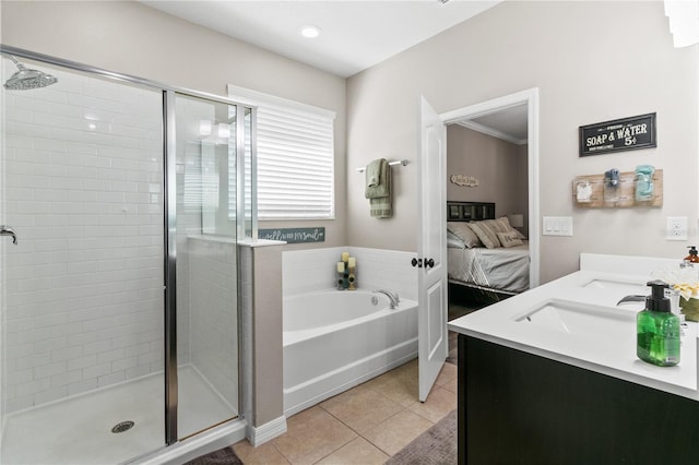 ensuite bathroom featuring double vanity, a stall shower, tile patterned flooring, ensuite bathroom, and a bath