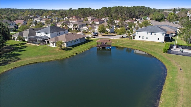 bird's eye view featuring a residential view and a water view