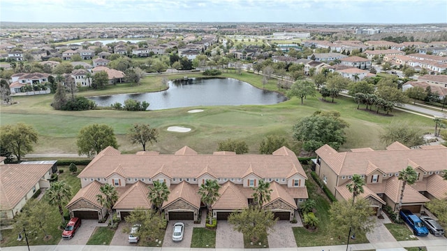 aerial view featuring golf course view, a residential view, and a water view