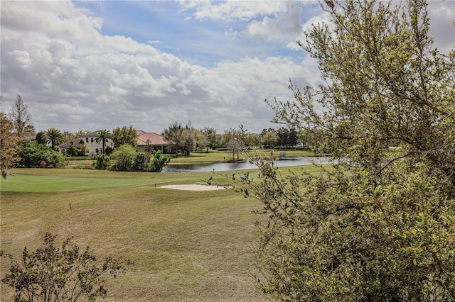 view of home's community featuring a yard and a water view