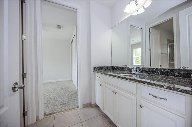 bathroom featuring tile patterned flooring, visible vents, and vanity