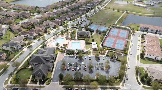 birds eye view of property featuring a residential view and a water view