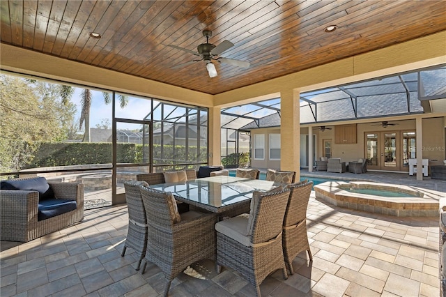 sunroom / solarium with a swimming pool, wood ceiling, and a ceiling fan