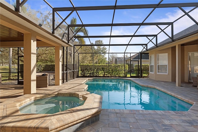 view of swimming pool with glass enclosure, a patio, and a pool with connected hot tub