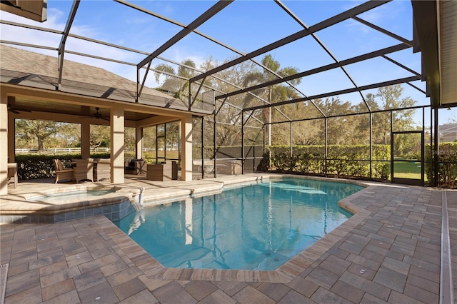 view of swimming pool with a patio, a ceiling fan, a pool with connected hot tub, outdoor lounge area, and a lanai