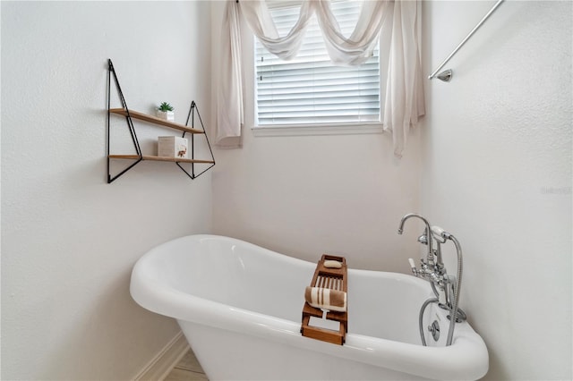 full bathroom featuring a wealth of natural light and a soaking tub