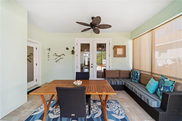 sunroom featuring french doors and a ceiling fan