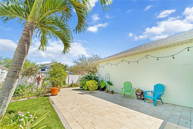 view of patio / terrace featuring fence