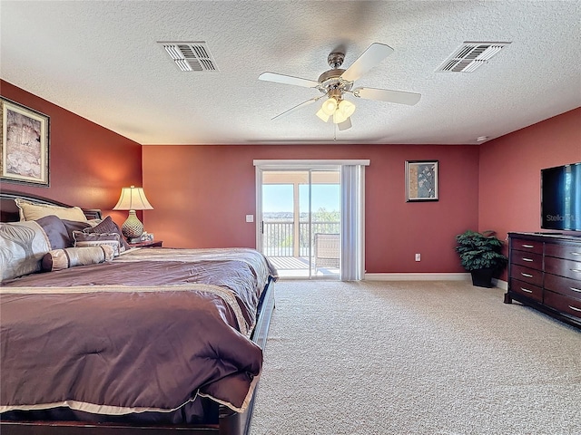 bedroom with access to outside, light colored carpet, visible vents, and ceiling fan