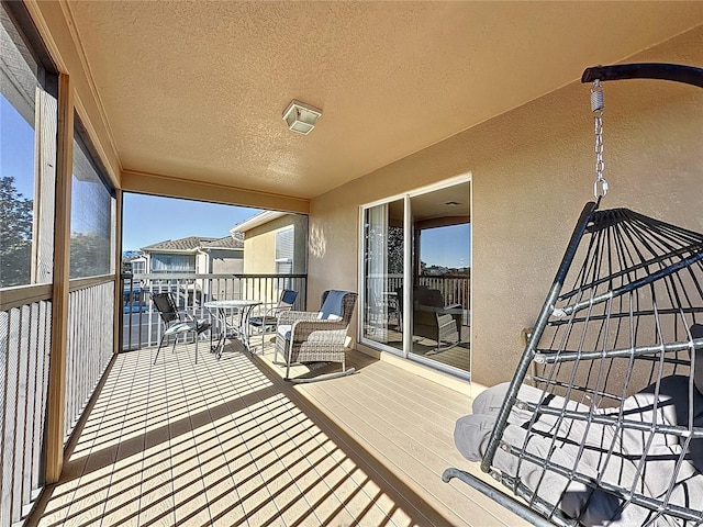 balcony featuring a sunroom