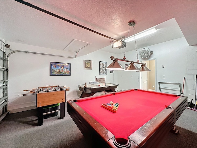 recreation room with a garage, carpet floors, and a textured ceiling