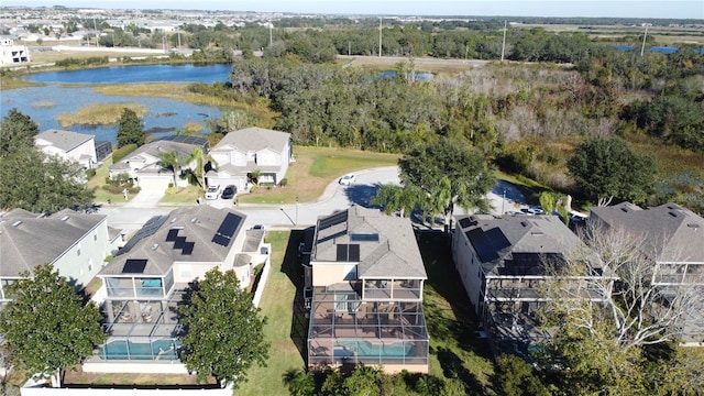 bird's eye view featuring a residential view and a water view