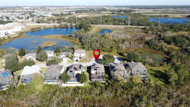 birds eye view of property featuring a residential view and a water view