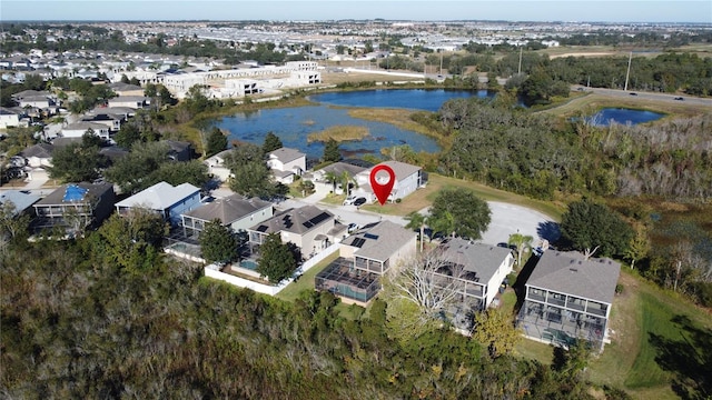 bird's eye view featuring a residential view and a water view