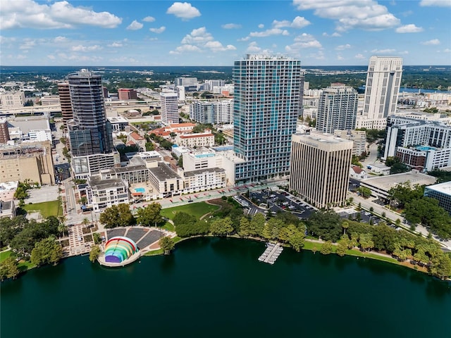 birds eye view of property with a city view and a water view