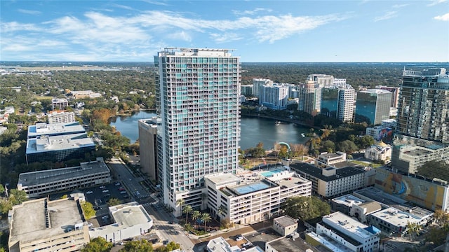 birds eye view of property featuring a city view and a water view