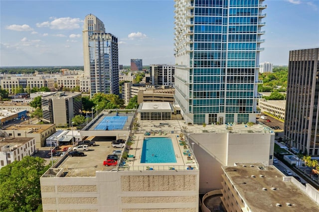 view of swimming pool with a view of city