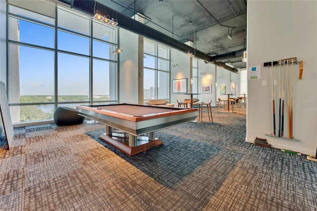 game room with a water view, billiards, carpet, a high ceiling, and baseboards