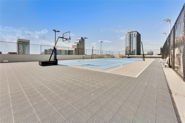 view of sport court featuring community basketball court and fence