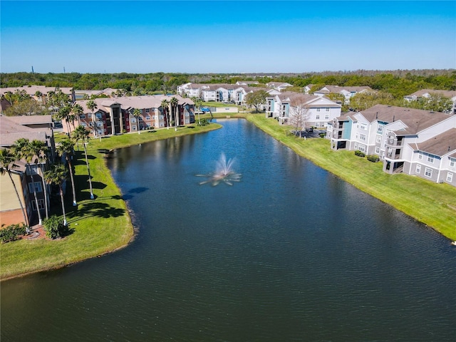 bird's eye view with a residential view and a water view