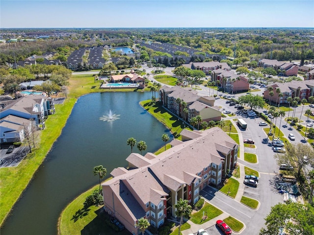 bird's eye view featuring a water view and a residential view