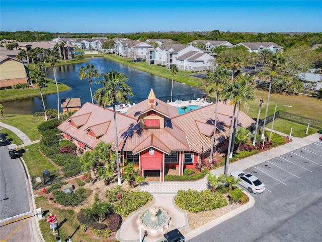 drone / aerial view with a residential view and a water view