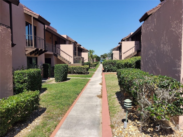 view of community with a residential view and a lawn